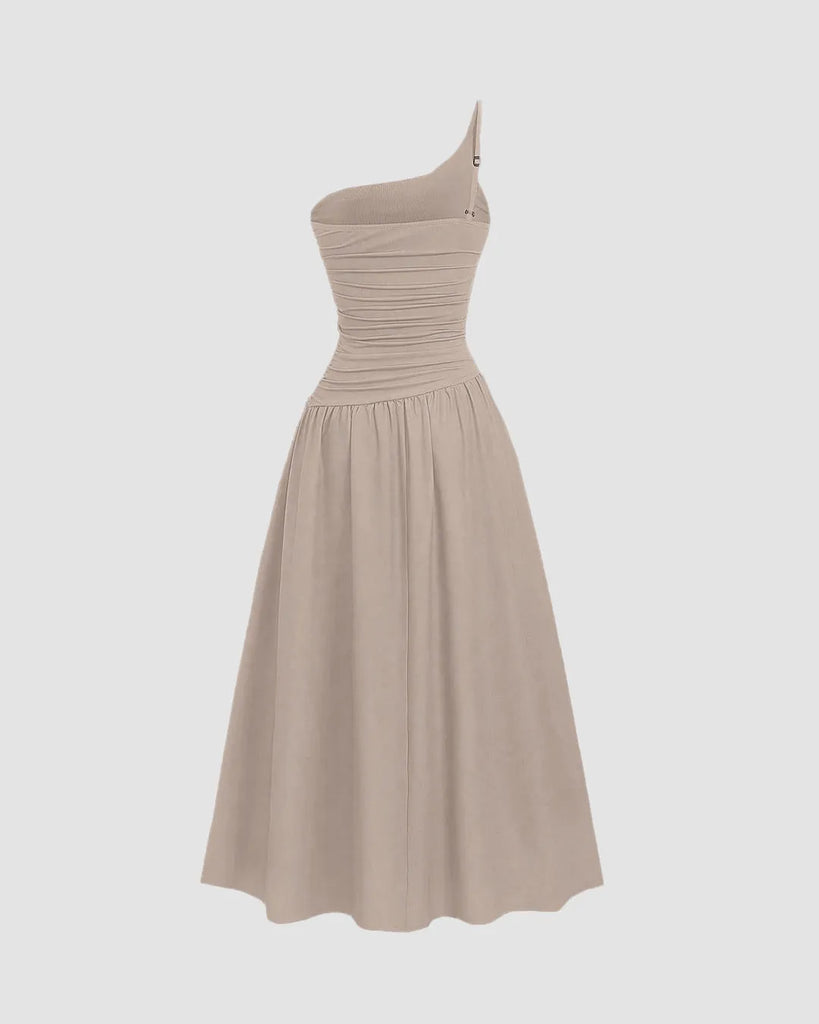 Back view of a Beige asymmetrical neck midi dress with long flared dress with sleeveless look perfect for a vacation