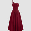 Maroon midi dress featuring a one-shoulder neckline and ruched bodice, exuding bold energy with elegant flair