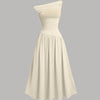 Front view of beige midi dress with asymmetrical neckline, ruched bodice and flowy skirt for an elegant silhouette.