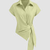 Women's green polo shirt with a front knot, featuring an asymmetrical tie waist design in herbal color.
