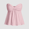 Baby pink twist-front empire bustier top with a sweetheart neckline, designed to flatter curves with a flowy fit
