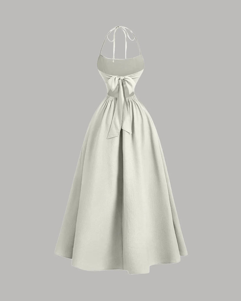Cream halter-neck midi dress with a back tie and gathered detailing for a soft, elegant drape.