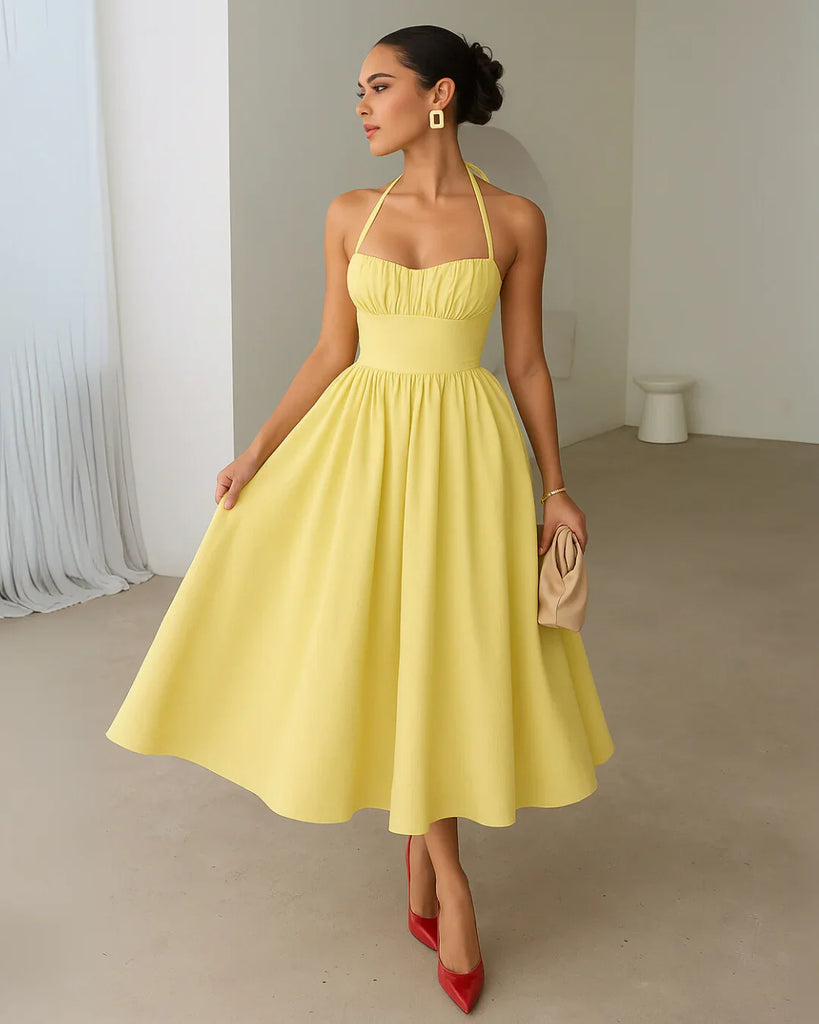 Yellow Back Tie Halter Neck Gathered Midi Dress featuring a ruffled neckline, styled in French Vanilla.