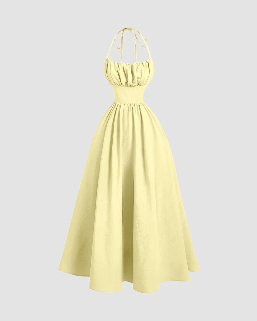 Yellow Back Tie Halter Neck Gathered Midi Dress featuring a ruffled neckline, styled in French Vanilla.
