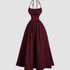 Maroon halter-neck midi dress with a back tie and gathered detailing for a rich, elegant drape.