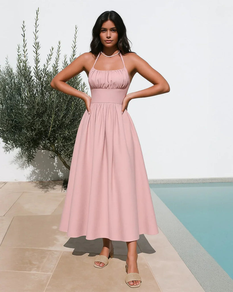 Powder pink halter-neck midi dress with a back tie and gathered detailing for a softly elegant drape.
