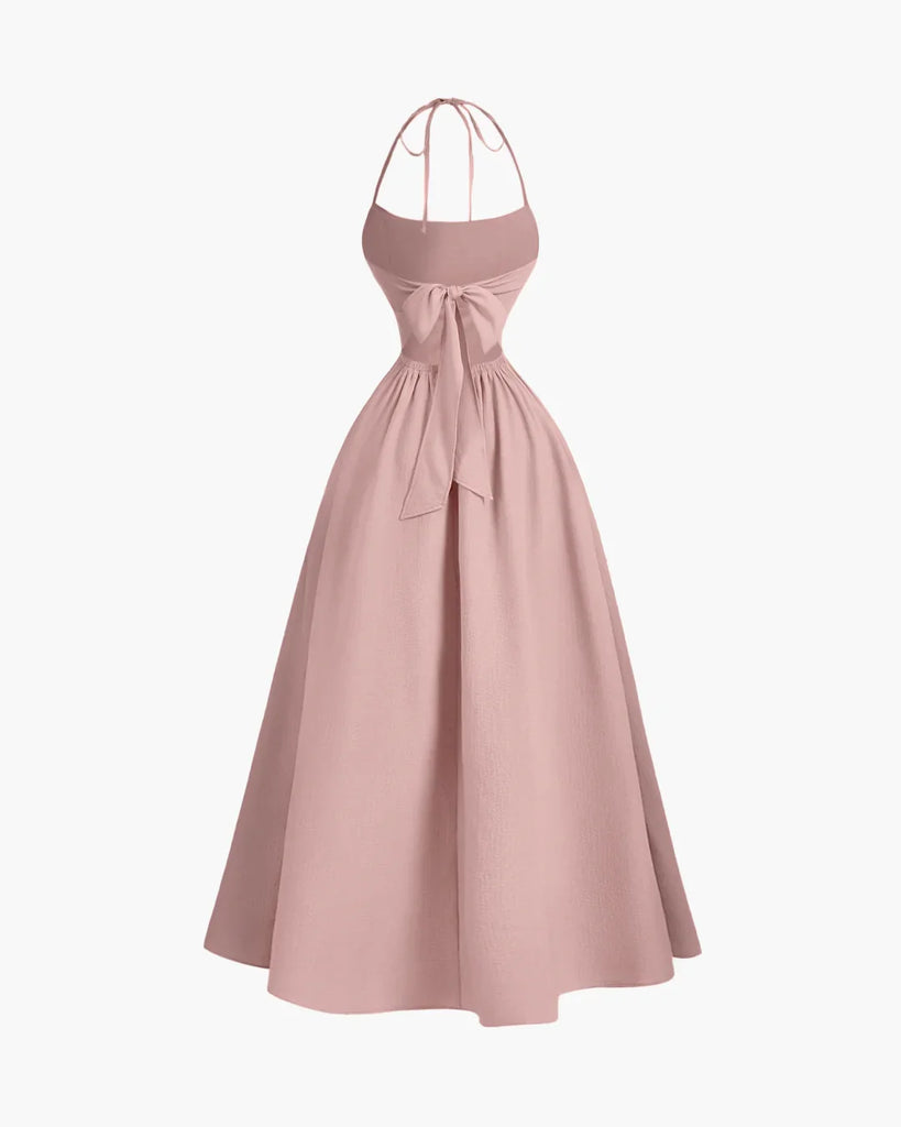 Powder pink halter-neck midi dress with a back tie and gathered detailing for a softly elegant drape.