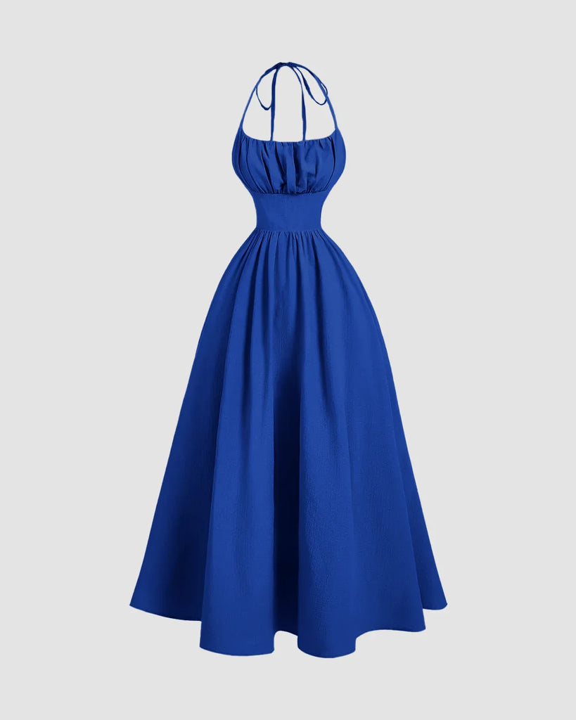 A gathered midi dress in surf blue featuring a stylish stop neck and back tie halter design.