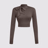 Coco brown cropped turtleneck top with a bow tie, designed for a slim fit, ideal for back-to-school outings.