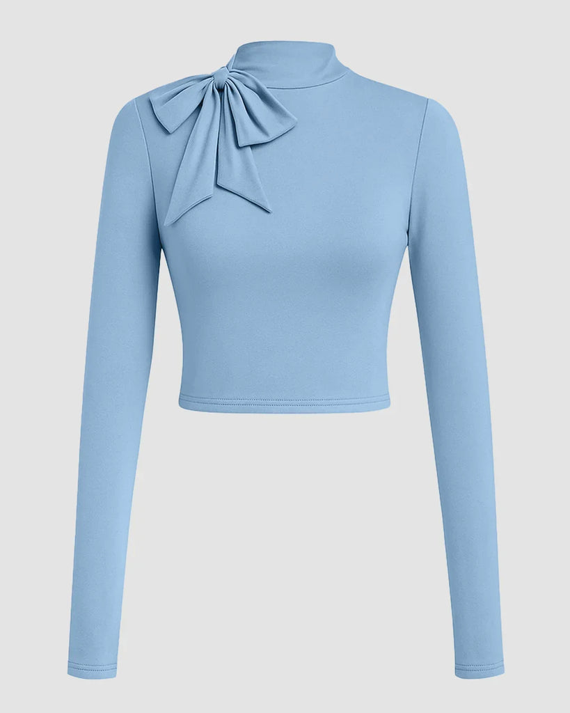 Powder blue cropped turtleneck top with a bow tie, designed for a slim fit