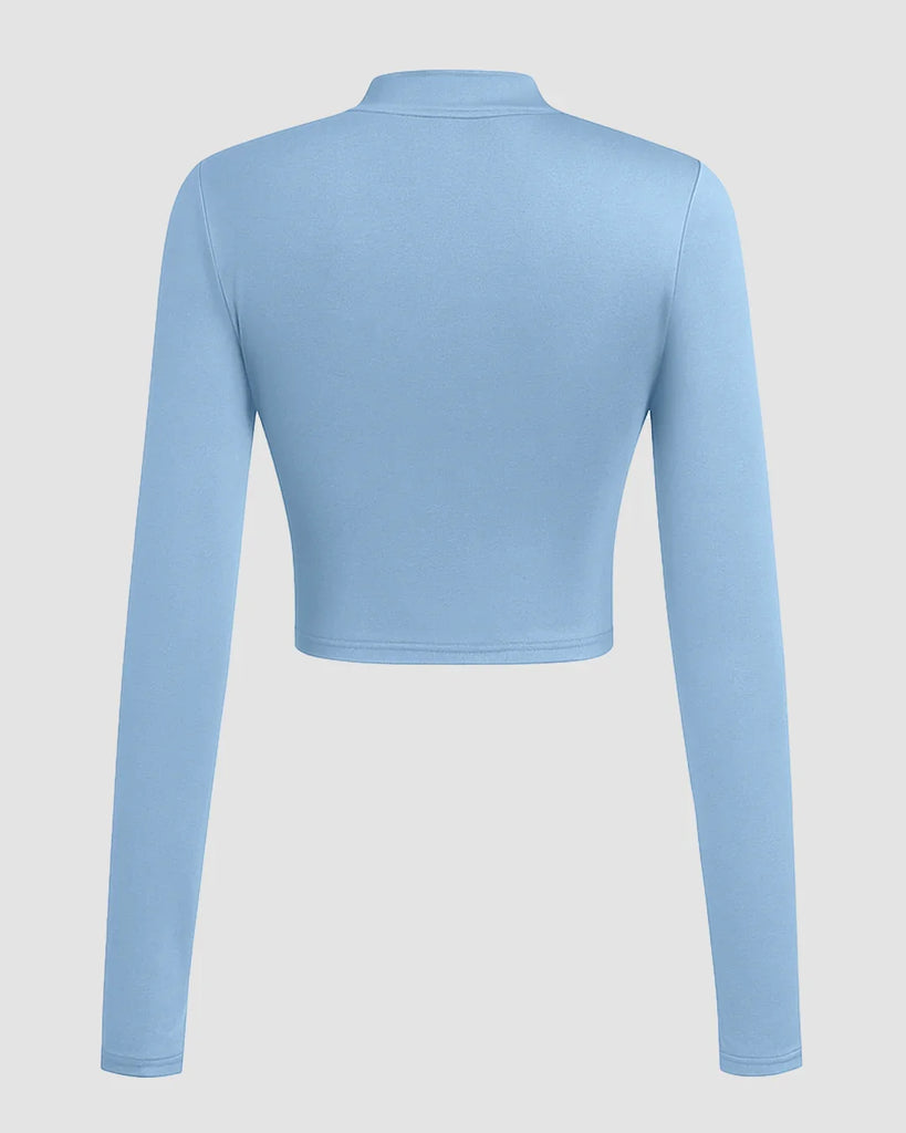 Powder blue cropped turtleneck top with a bow tie, designed for a slim fit