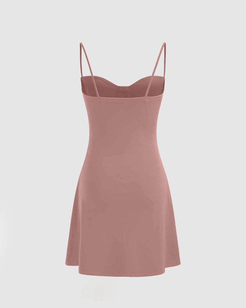 Back view of Solid pink slip dress with a soft, stretchy material, featuring a bustier cami design for a comfortable fit
