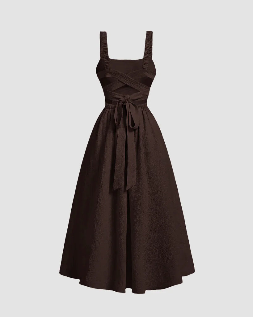 Backless criss-cross bow design flared dress in chocolate, featuring a square neckline and playful detailing for a flattering look.