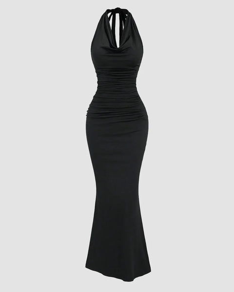 Front view of Black halter backless bodycon mermaid dress with ruched detailing and flared hem, shown in a clean studio product view