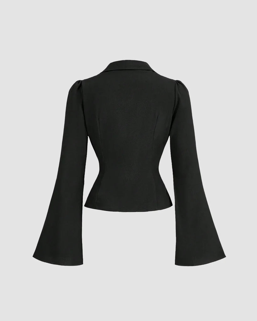 back side of A chic blouse featuring a cinched waist, ruched bust, V-neckline, and a sharp collar, perfect for making a bold statement