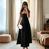 Black strapless fit and flare midi dress with a fitted bodice and flared hem, offering chic style and all-day comfort.