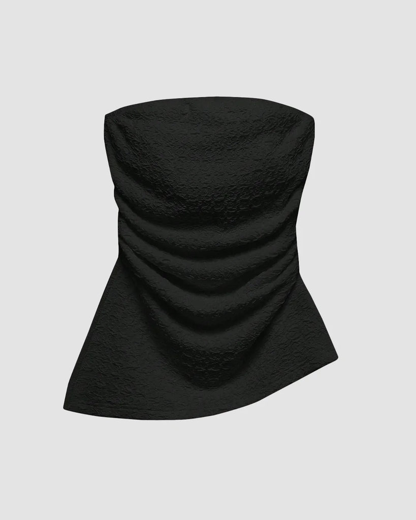 Ruched black tube top with an asymmetric hem, featuring a soft, textured design that flatters and adds a flirty touch