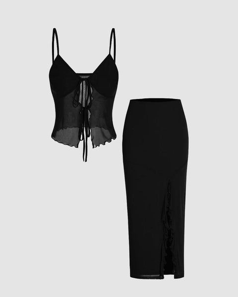 Black top and skirt set featuring a mesh sweetheart top and a split maxi skirt, elegantly styled for a chic look.