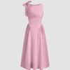 Dark pink midi dress with a boat neck and bow detail at the shoulder, featuring a fit and flare silhouette.