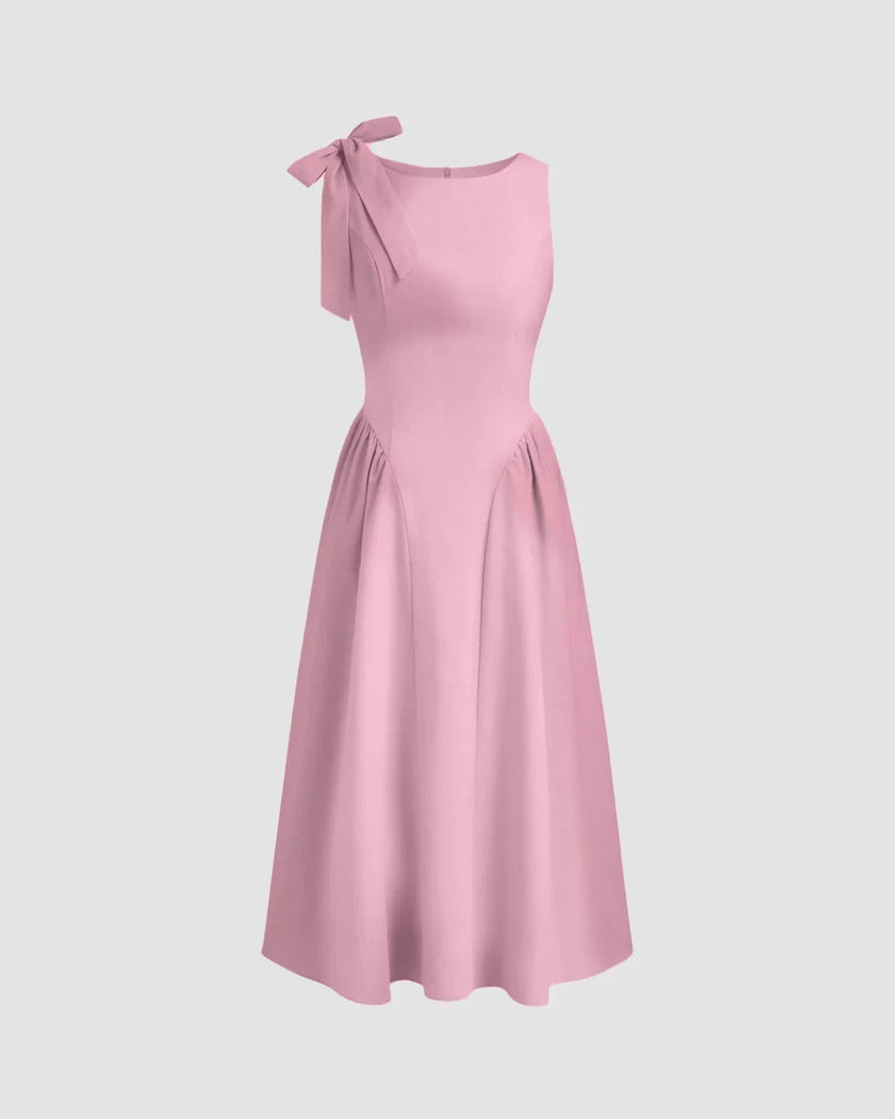 Dark pink midi dress with a boat neck and bow detail at the shoulder, featuring a fit and flare silhouette.