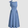 A fit and flare midi dress in French blue, showcasing a boat neck design and a decorative bow.