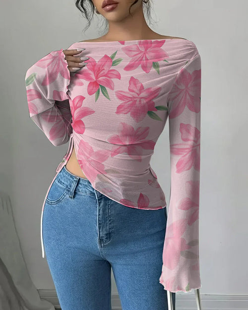 Front view of pink cute top with boat neck and floral print, slim fit with asymmetrical hem and full sleeves