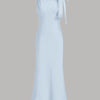 Front view of ice blue boat neck maxi dress with bow detail on shoulder and flared hem, elegant blue maxi dress.