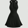 A bodycon black dress featuring a stylish cut-out neckline, perfect for summer occasions.
