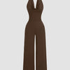 Brown halter cowl neck jumpsuit featuring wide legs, perfect for a stylish and comfortable outfit choice.
