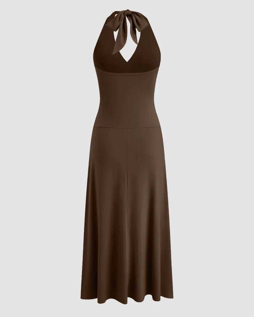 Back view of a Brown halter neck midi dress with a backless design and ruched waist, showcasing a stylish and elegant silhouette.