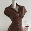 Front view of brown polka dot collared button down top with short sleeves and fitted shape, stylish womens button top.