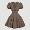 Front view of Brown puff sleeve flare mini dress with a V-neckline and bow detail, featuring a fitted bodice and flowy skirt for a soft feminine look