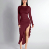 Long-sleeved burgundy dress featuring a high slit and ruffle hem, elegantly ruched for a flattering silhouette.
