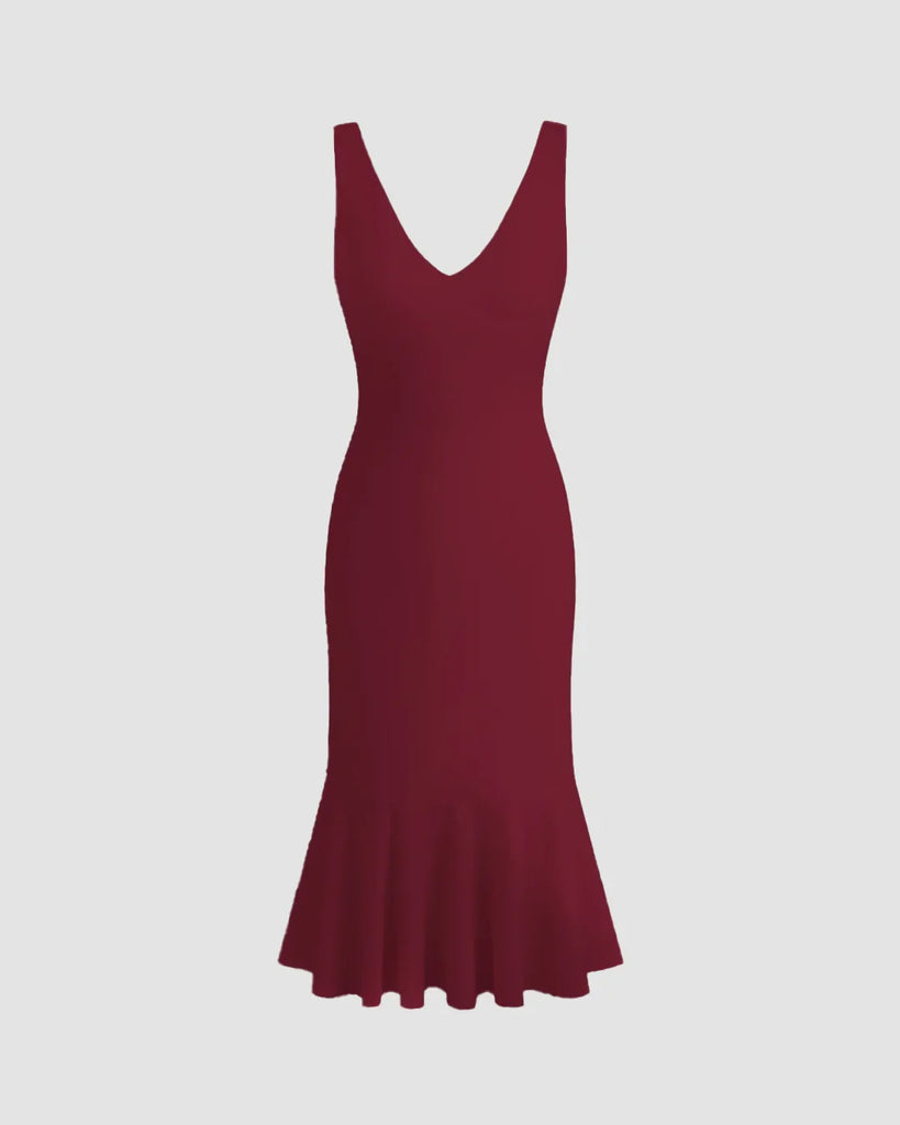 Burgundy sleeveless bodycon dress with a fishtail hem, crafted from soft knit fabric.