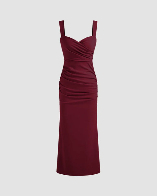 Front view of Burgundy V-neck midi dress featuring a ruched bodice, fitted waist, and subtle fishtail hem for a flattering silhouette.
