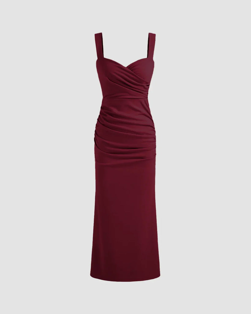  Burgundy V-neck midi dress featuring a ruched bodice, fitted waist, and subtle fishtail hem for a flattering silhouette.