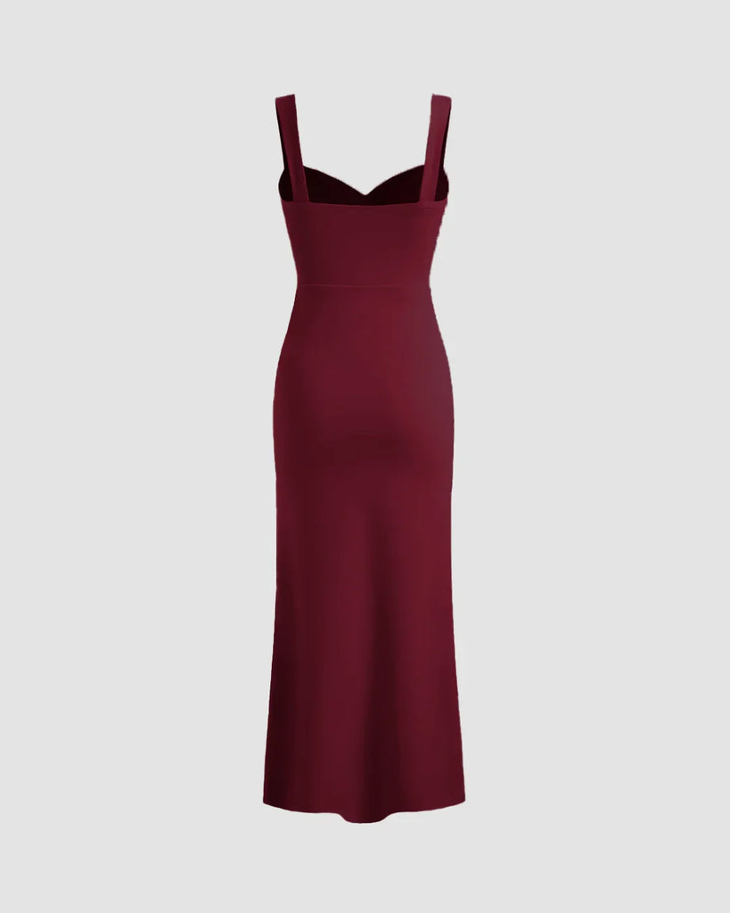 Back view of a Burgundy V-neck midi dress featuring a ruched bodice, fitted waist, and subtle fishtail hem for a flattering silhouette.
