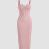 Dusty pink bodycon midi dress with spaghetti straps and a corset-style bustier, designed with stitched panel lines for a chic look.