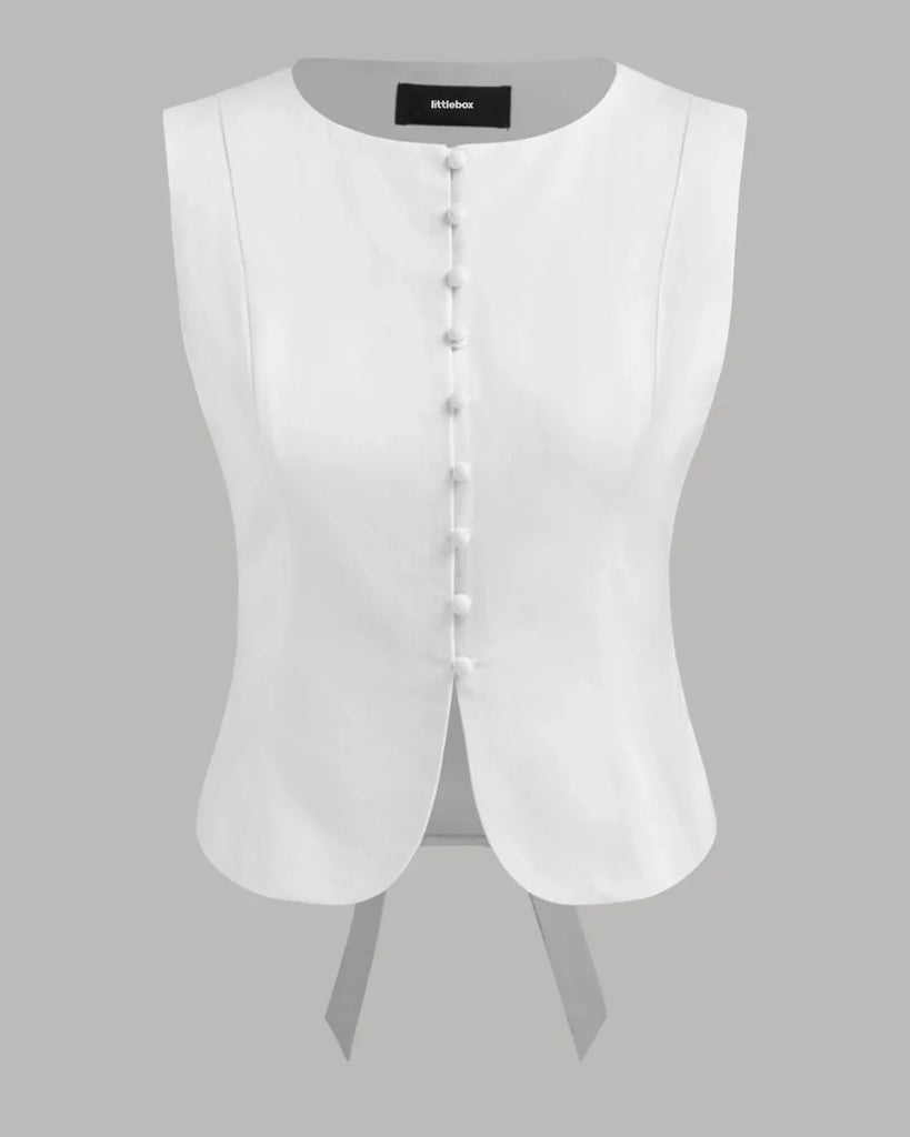 White tailored sleeveless top with a button front design, showcasing a classic and elegant style.