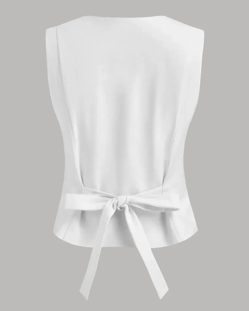 Back view of a White tailored sleeveless top with a button front design, showcasing a classic and elegant style.