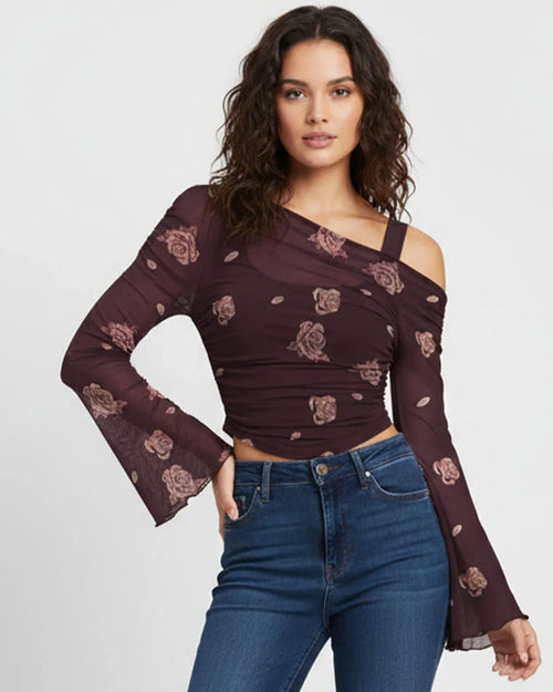 Women wearing Stylish floral print one shoulder top with soft stretch fabric, perfect for casual outings and trendy day looks.