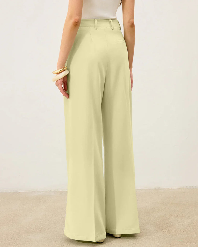 Back view of a woman in a checkered asymmetric top and wide-legged trousers, showcasing a stylish co-ord set.