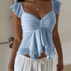 Front view of blue mesh top with ruched front, ruffle sleeves and asymmetrical hem for a soft feminine look.