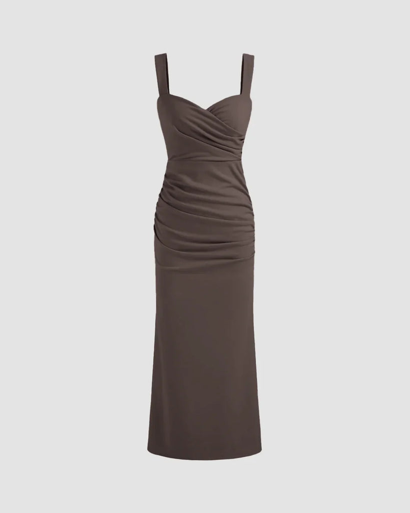 Coca V-neck midi dress featuring a ruched bodice, fitted waist, and subtle fishtail hem for a flattering silhouette.