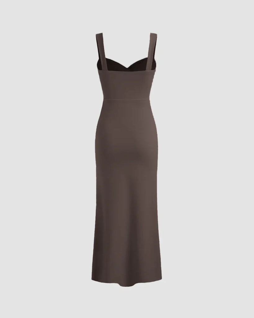 Back view of a Coca V-neck midi dress featuring a ruched bodice, fitted waist, and subtle fishtail hem for a flattering silhouette.