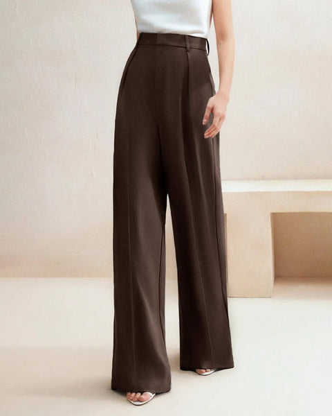 Front view of High waist tailored trousers in cocoa brown with wide legs, smooth fabric, and a clean full length structured silhouette.