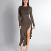 Model in a brown long-sleeve dress with a high slit, showcasing the Coco Ruched High-Slit Ruffle Hem design.
