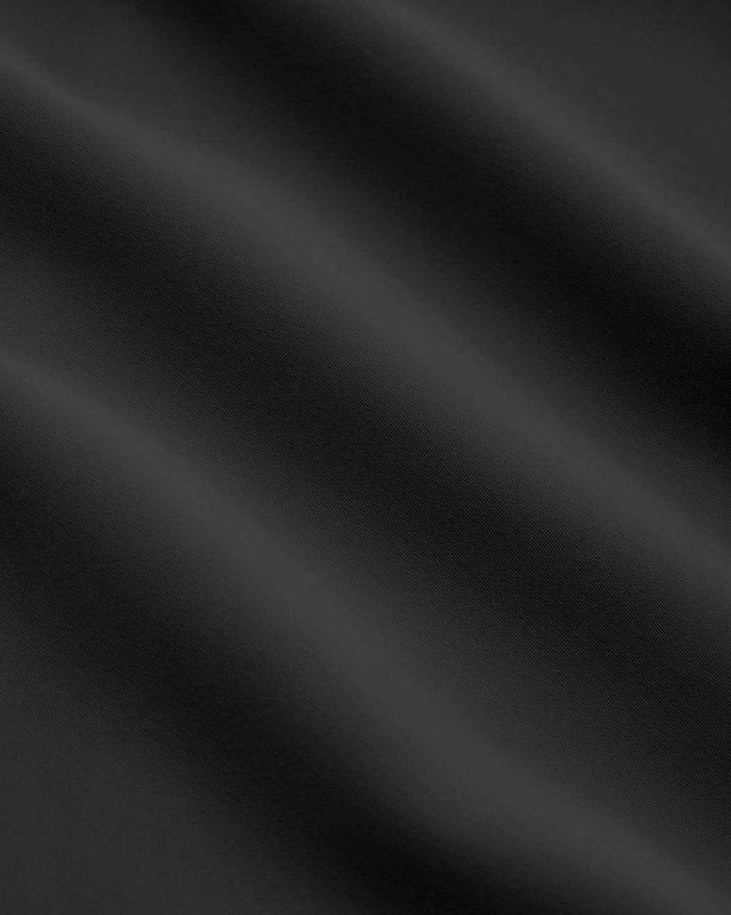 Material of Cropped black full sleeve top with a collar, long sleeves, and ruched details, made from soft, lightweight fabric.