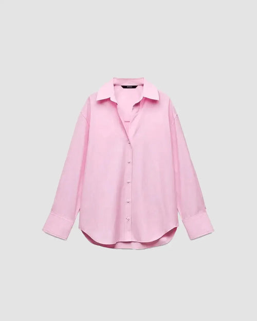 Front view of classic striped Oxford shirt in pastel pink, featuring a relaxed fit, button-down front, and long sleeves with wide cuffs