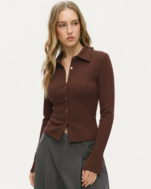 Women wearing Brown long sleeve top with a collared neckline, button front, and split hem detail, designed in a fitted silhouette for a sleek look